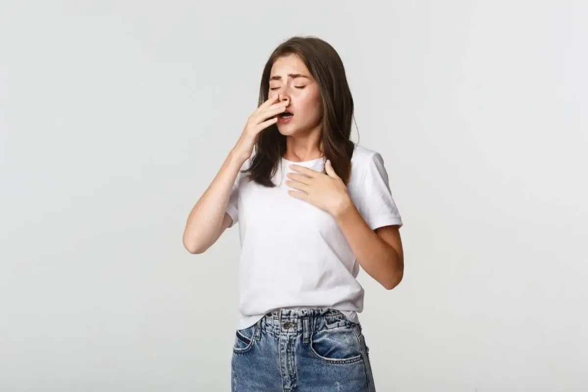 Allergy - women is sneezing