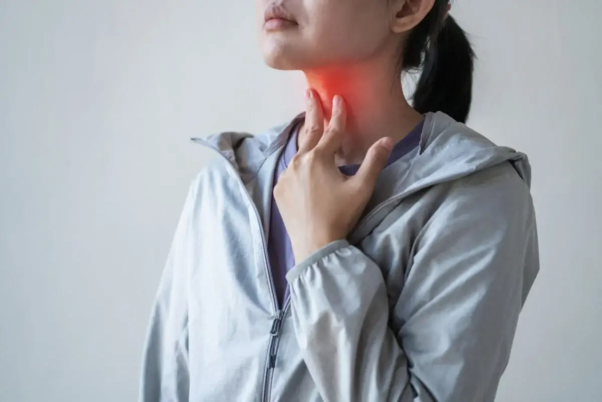 women having throat pain